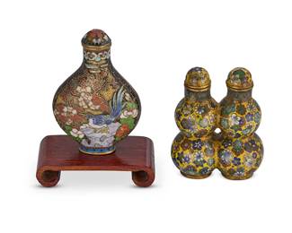 2166
Two Chinese enameled metal snuff bottles
Late 19th/20th century
Comprising a cloisonné enamel double snuff bottle and a champlevé snuff bottle raised on a wood stand
2 pieces
Double bottle: 2.5" H; Champlevé without stand: 2.75" H
Estimate: $300 - $500