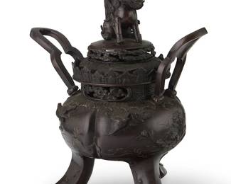 2346
A Japanese bronze figural censer
20th century
The lidded censer raised on tripod legs, with opposed handles, bands of openwork, and bird figures in relief, the lid featuring a Shishi figural finial
14.25" H x 12.625" W x 9.5" D
Estimate: $400 - $600