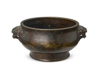 2134
A Chinese bronze censer
Likely Qing Dynasty (1655-1912) or later
Underside bearing an apocryphal reign mark for Xuande Period (1426-1435)
The footed bowl with opposed makara handles
2.75" H x 6" W x 4.75" D
Estimate: $2,000 - $3,000