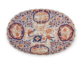 2207
A Japanese Imari porcelain centerpiece bowl
19th century
With blue underglaze mark to underside
The shallow oval bowl with scalloped rim and blue and red floral motifs
3.75" H x 19.5" W x 24.5" D
Estimate: $800 - $1,200