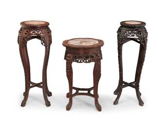 2325
Three Chinese carved wood and marble plant stands
Late 19th/early 20th century
Comprising three marble-topped stands, each with elaborately carved openwork floral and figural motif aprons, raised on four conformingly carved legs joined by a stretcher, consisting of two with round tops and one with a scalloped top
3 pieces
Largest: 36" H x 13" Dia.; Smallest: 28" H x 18" Dia.
Estimate: $600 - $800