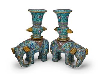 2136
A pair of Chinese cloisonné elephant vases
20th century
Each gilt copper and enamel vase decorated with floral motifs, phoenix figures, and toatie masks, the upper element featuring opposed bird-form masks in high relief, set in an elephant-form base
2 pieces
Each overall: 18" H x 14" W x 7.75" D
Estimate: $700 - $900