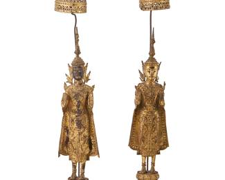 2297
A pair of Thai gilt-bronze Buddha figures
Late Rattanakosin Era, 19th century or later
Each figure with inlaid mirror accents throughout, depicted under a triple baldachin canopy overhead and hands in abhaya mudra, standing on a four-tiered base
2 pieces
Each: 25.75" H x 4.5" W x 4.25" D approximately
Estimate: $300 - $500