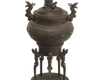 2342
A Japanese bronze figural censer
Meiji Era (1868-1912) or later
With Japanese inscription to underside of body possibly reading 'Dainihon Kanda Kawabe-zumi Shokaken I-no-[ten]'
The lidded censer with opposed dragon-form handles and raised on four legs in the form of guardian lions, featuring a finial in the form of a seated man with a frog
22" H x 11.75" W x 10.5" D
Estimate: $1,000 - $2,000
