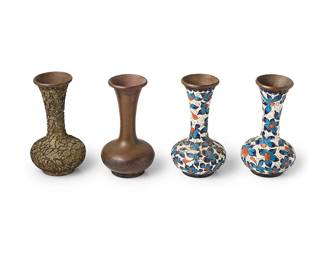 2059
Four Chinese cloisonné sample vases
20th century
Each depicting a stage in the process of creating a cloisonné vase, one as the copper base, another with gilt and copper wiring, and two with enamel filled into the copper wiring
4 pieces
Each: 4.5" H x 2.75" Dia.
Estimate: $200 - $300