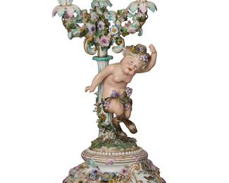 2409
A Dresden porcelain figural candelabrum
19th century
With pseudo underglaze blue crossed swords
The four-light candelabrum with a satyr figure standard, decorated with floriform and foliate motifs throughout, raised on four scrolled feet
21.5" H x 9" W x 9" D
Estimate: $300 - $400