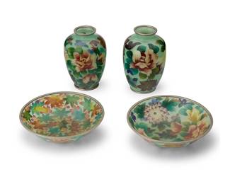 2065
A group of East Asian plique-à-jour items
20th century
Each unmarked
Comprising two footed dishes and two vases, depicting floral and foliate motifs
4 pieces
Taller vase: 5.25" H x 3.5" Dia.; Each tray: 1.625" H x 6" Dia.
Estimate: $300 - $500