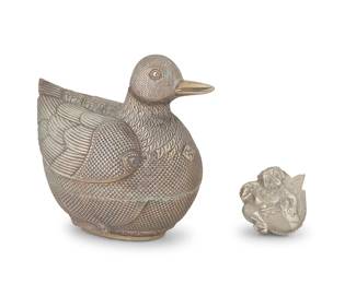 2281
Two Burmese silver figural boxes
20th century
The duck marked to underside: 1900
Comprising a large duck-form box and a small box with a mythical creature to the lid
2 pieces
Duck: 10.5" H x 7.25" W x 12" D; Box: 3" H x 4" W x 4" D
Total weight: 38.8 oz. troy approximately
Estimate: $500 - $800