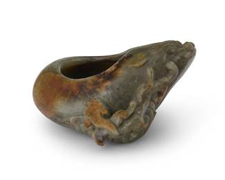 2328
An Asian carved stone brush washer
20th century
The shaped ovoid bowl carved with a lion's face and scrolls
2.5" H x 4.75" W x 4.5" D
Estimate: $300 - $500