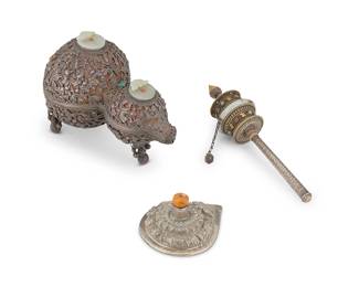 2304
An assembled group of Vajrayana Buddhist implements with jade and silver elements
20th century
Comprising a hardstone, jade, and silver-mounted double gourd box, a prayer wheel, and an associated silver cover
3 pieces
Prayer wheel: 11" H x 3.25" Dia.; Box: 7.25" H x 10" W x 5.5" D; Cover: 2.75" H x 6" W x 4.75" D
Estimate: $800 - $1,200