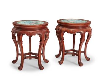 2055
A pair of Chinese hardwood and cloisonné stools
20th century
Each carved wood stool with inset cloisonné enamel top depicting lotus blooms, above a shaped apron raised on four curvilinear legs joined by a curved box stretcher
2 pieces
Each: 20" H x 16.25" Dia.
Estimate: $300 - $500