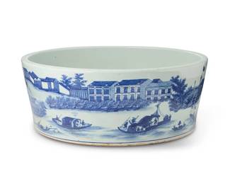 2178
A Chinese blue and white porcelain basin
19th century or later
The wide bowl exterior depicting Hongs trading houses on the Pearl River, Canton and merchants in boats, the interior with a building in front of a fenced courtyard
8.5" H x 21.75" Dia.
Estimate: $1,000 - $2,000