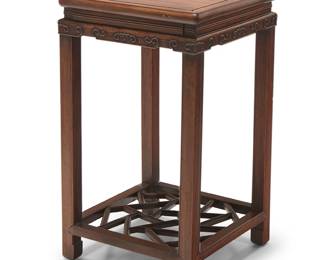 2188
A Chinese hardwood side table
Early/mid-20th century
The table with single drawer to one side, above an apron with carved accents, raised on square legs joined by an openwork shelf stretcher
30.5" H x 17.25" W x 17.25" D
Estimate: $600 - $800