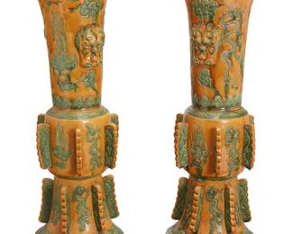 2190
A pair of Chinese ceramic gu-form vases
19th century or later
Each with impressed chop mark to base
Each with a sancai-style glaze palette, depicting incised phoenix and dragon figures, with opposed masks in relief
2 pieces
Each: 40" H x 15.25" Dia.
Estimate: $600 - $900