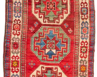 2034
A Kazak geometric runner
Early 20th century
Wool on wool foundation
10' 1" L x 4' 2" W
Estimate: $500 - $700