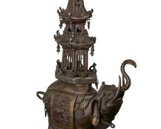 2203
A Japanese gilt-bronze figural censer
Meiji Period (1868-1912) or later
Bearing makers mark perhaps reading: Kinsei Muneoto Seizo
The elephant-form censer depicted with elaborate howdah decorated with dragon and meandering motifs below a pagoda-form lid with dragon-form handle, each mounted with hanging accents
10.375" H x 13.25" W x 4.75" D
Estimate: $800 - $1,200