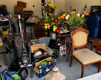 Garage full of Miscellaneous, Several vacuum cleaners, carpet shampooers, Flower Arrangements, etc