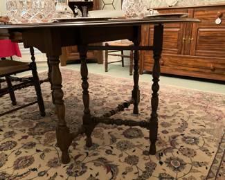 Antique drop leaf gate leg dining table with three additional leaves (all in table in picture). Full size is 41” W x 85” L.