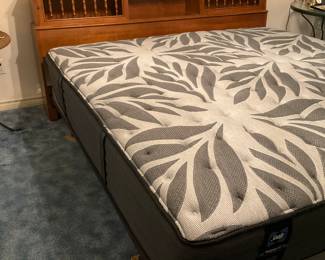 King bed with maple bookcase headboard.