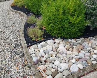 Belgian blocks; river rocks; shrubbery