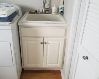 Laundry sink; louvered bifold doors