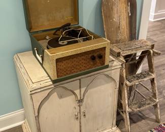  3 in 1 stool, seat ironing board, and record player

2 door cabinet is NOT for sale 