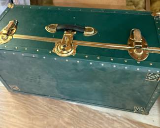 Green trunk with brass accents
