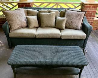 Green wicker settee and table