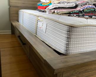King size bed on platform with 1 drawer on each side.