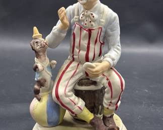 Porcelain Seated Clown w/ Dog on Ball Figurine