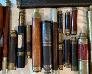 Many antique hand scopes, telescopes