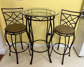 Charming bistro table and two chairs.