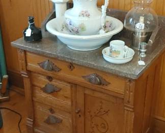 Antique Victorian Oak East Lake wash stand with carved fruit wood hardware
Beautiful speckled marble top