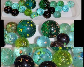Vintage confetti Galaxy asteroid marbles the black ones are amber in color when held to the light