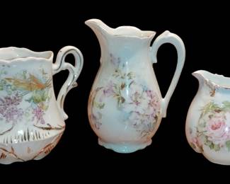 German hand painted cream pictures with purple flowers ( two on the left)
Far right bone china pink roses