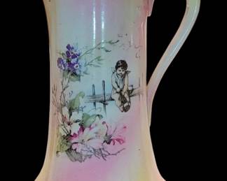 French pitcher Sevres France
Hand Painted floral Angel sits on a fence with a goblet/ opening a bottle of wine/champagne