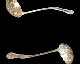 Made by H.J. Howe sterling silver cream ladle separator/ however it is the same pattern as Lancaster Rose Gorham Sterling Silver Sauce Cream Ladle
Back in the day this was used to scoop the cream off the top of the milk. 
More common uses were for soft spoons small gravy ladles jelly or more likely berry spoons. The center of the scallop bowl is a slightly different color because it has it is gold washed
Gorgeous Rose handle dated 1910 on the back with a monogram of the name "Nina "on the front