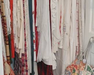 Closet full of gorgeous tablecloths located in the craft room