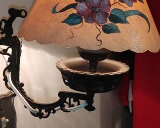 Charming Vintage wrought iron swinging wall lamp with glass globe. Hand-painted pansy paper shade.
One time this lamp was rewired with a white cord which can be easily changed.