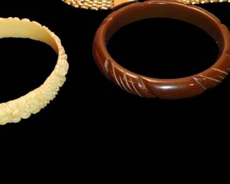 Vintage Brown Deeply Carved Bakelite Bracelet
celluloid moulded flowers bracelet