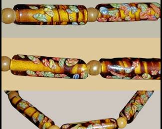 Vintage & very unusual Murano glass tube shaped beads on amber. Hand knotted with faux pearl accents. The design in the glass almost looks like individual pieces of candy!
We always get excited when we find authentic vintage jewelry ;it's so rare these days!