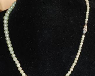 Genuine pearls with 14 karat gold white glass ( made for a small neck- possibly a children's necklace)