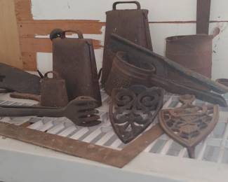Vintage cast iron items we will probably bring these inside cowbells and more
