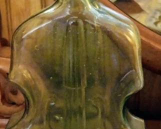 Vintage lime green shaped violin bottle
