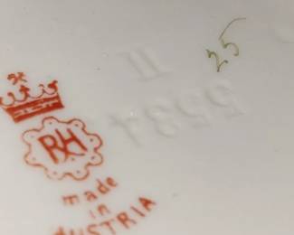 RH Robert Hanke 
Embossed numbers 5534 
& a gold 25