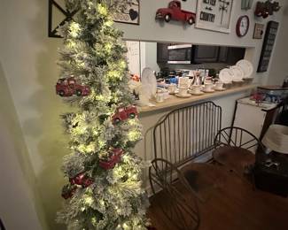 Tall white flocked Xmas tree