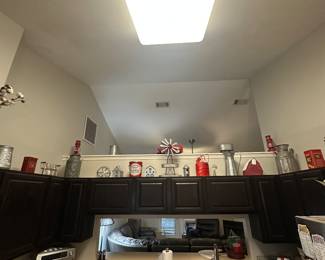 Above the cabinets in the kitchen 