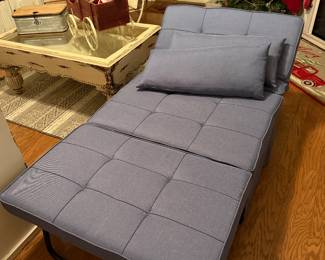 so we have two of these futons. They are two separate single chairs where the back raises up to support your back you can lay that down and then another piece is stored inside that opens up to make a twin futon or you can put them together and have a double Bed