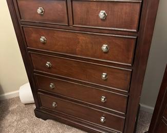 Tall dresser 2/439 inches wide 18 inches deep 50 inches tall we believe this is from Ashley