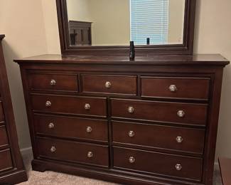 Long dresser with mirror 64 inches wide 18 inches deep 42 inches tall and the mirror is 35 inches tall